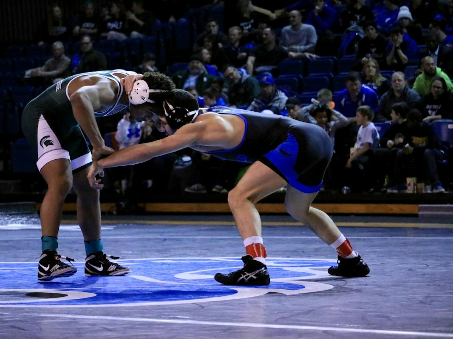 Senior 141-pounder Jason Estevez locks up with an opponent. Estevez is 7-7 on the year but is coming off a decisive victory against Northern Illinois.