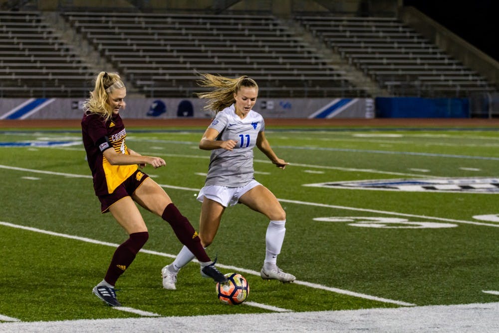 <p>Sophomore forward Marcy Barberic looks to steal the ball from a Central Michigan player. The Bulls soccer team has its last home game of the season this week against Akron.</p>