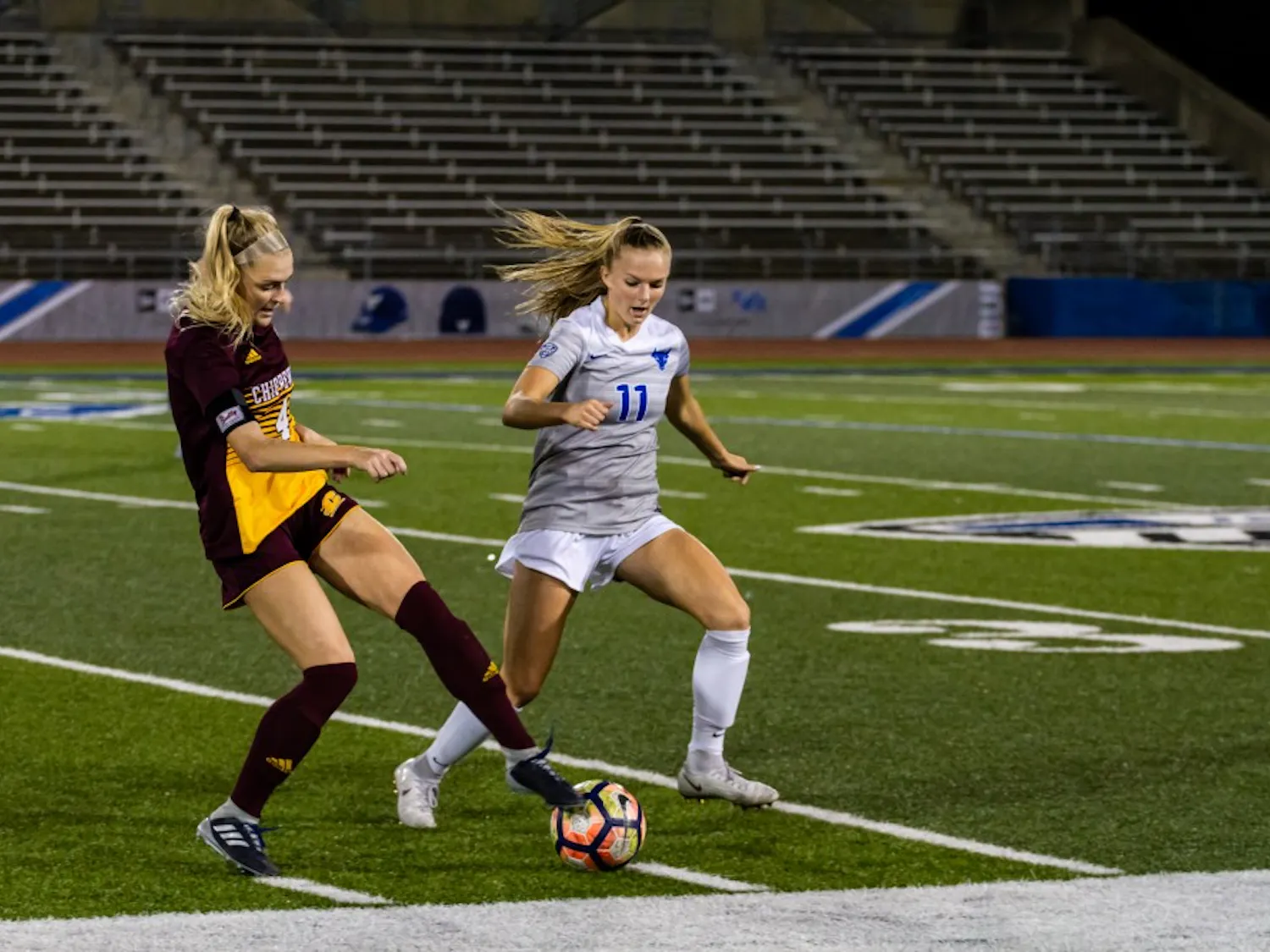 Sophomore forward Marcy Barberic looks to steal the ball from a Central Michigan player. The Bulls soccer team has its last home game of the season this week against Akron.