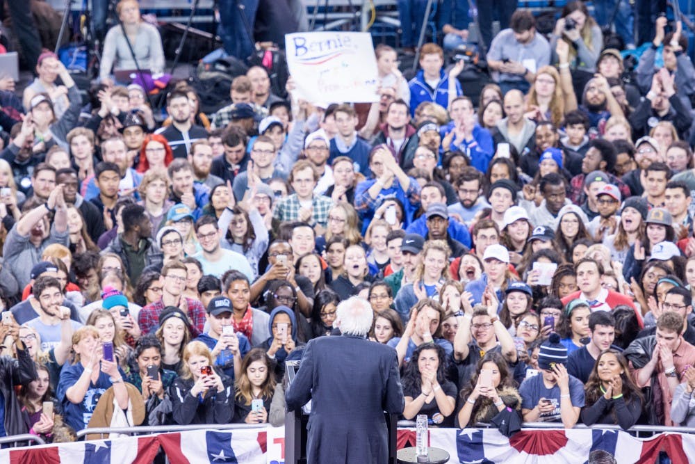 <p>Bernie Sanders looks out at his supporters during his "A Future to Believe In" rally&nbsp;in Alumni Arena Monday night.&nbsp;More than 11,000 people came out to the rally, with more than 8,000 getting inside and another 3,000 outside.&nbsp;</p>