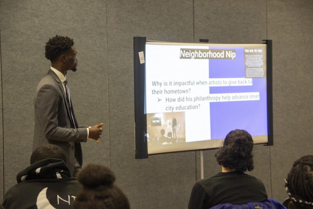 <p>The Black Student Union Vice President Daniel Edwards speaks to students to commemorate the life and death of rapper Nipsey Hussle on Wednesday.</p>