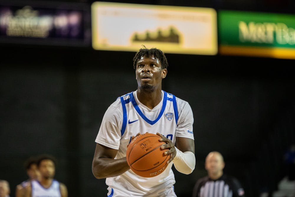 <p>Senior forward Josh Mballa (34) shoots a free throw during UB’s 105-54 exhibition victory over Medaille Nov. 4. The Bulls fell 68-65 to St. Bonaventure at Reilly Center Saturday.</p>