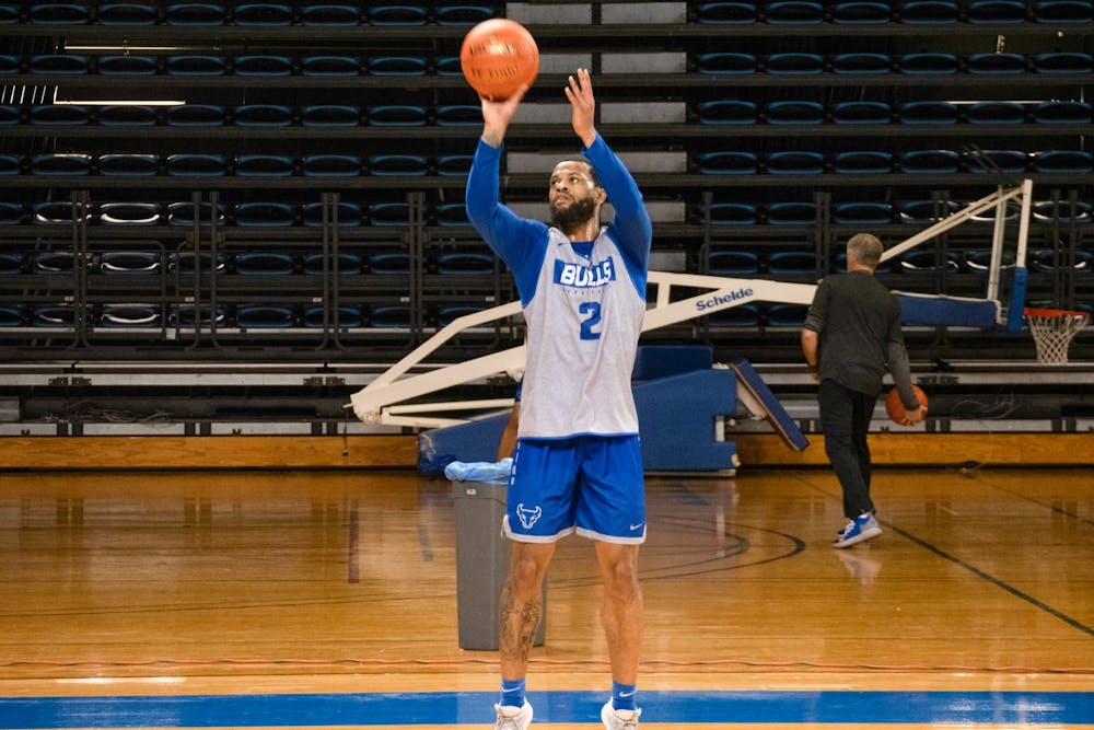 <p>Senior guard Antwain Johnson shoots a 3-pointer during practice at Alumni Arena. Johnson has scored 41 points for the Bulls this season.</p>