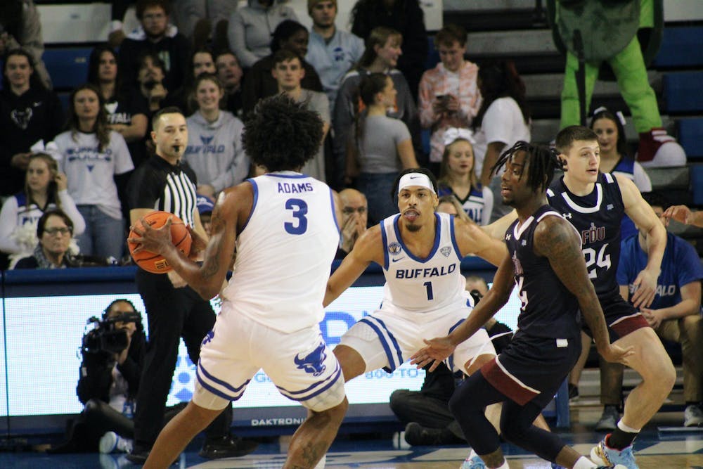 <p>UB's Isaiah Adams handles the ball in the team's home opener.</p>