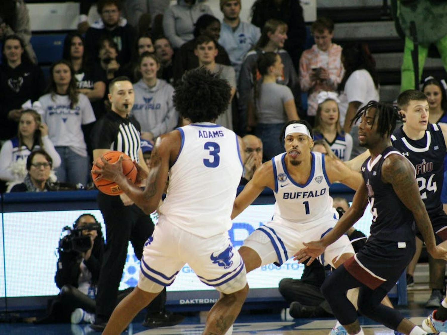 UB's Isaiah Adams handles the ball in the team's home opener.