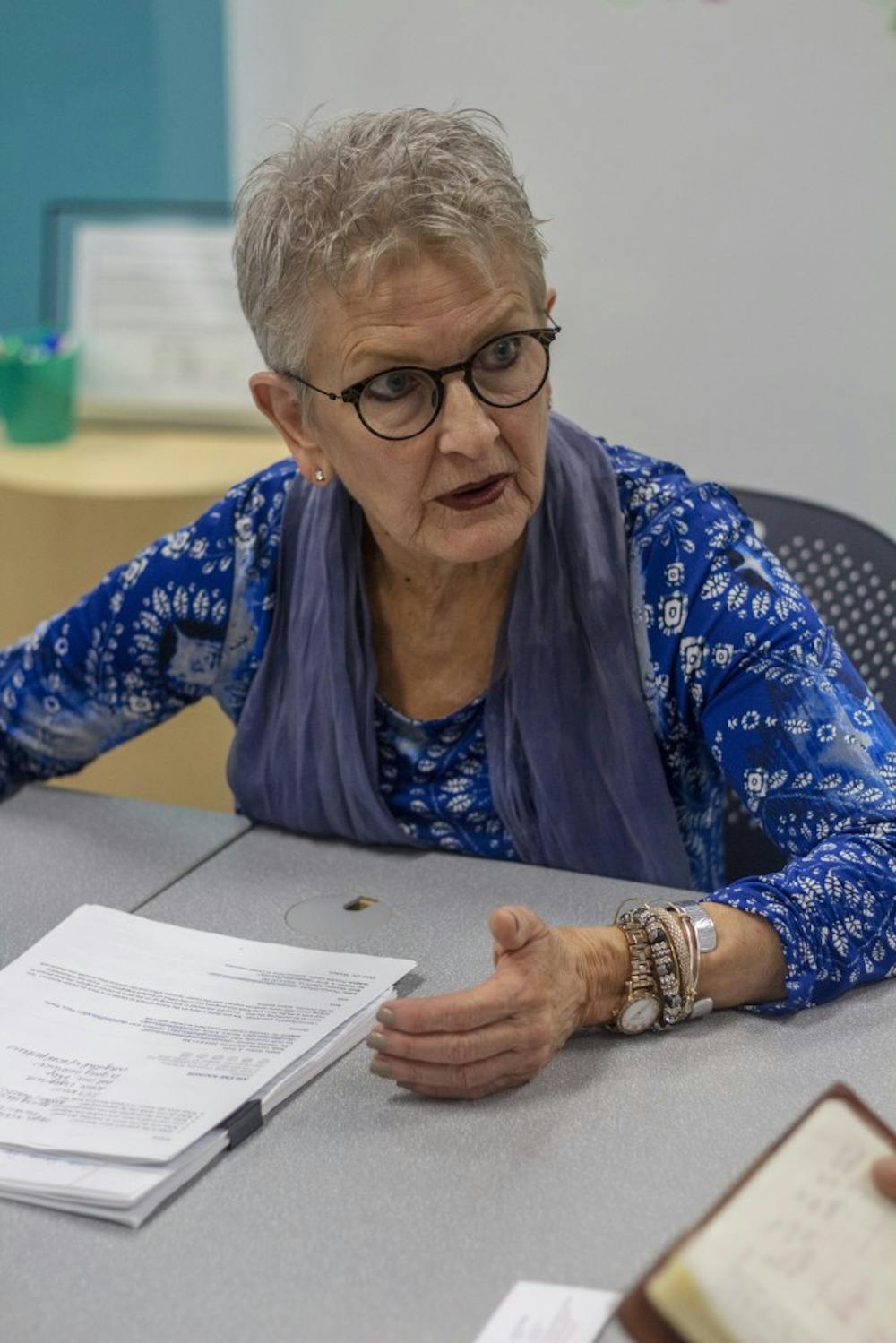 <p>Director of Career Services Arlene Kaukus sits at a table in Capen 259. Kaukus said she wants to make changes to make Career Services more prominent among students.</p>