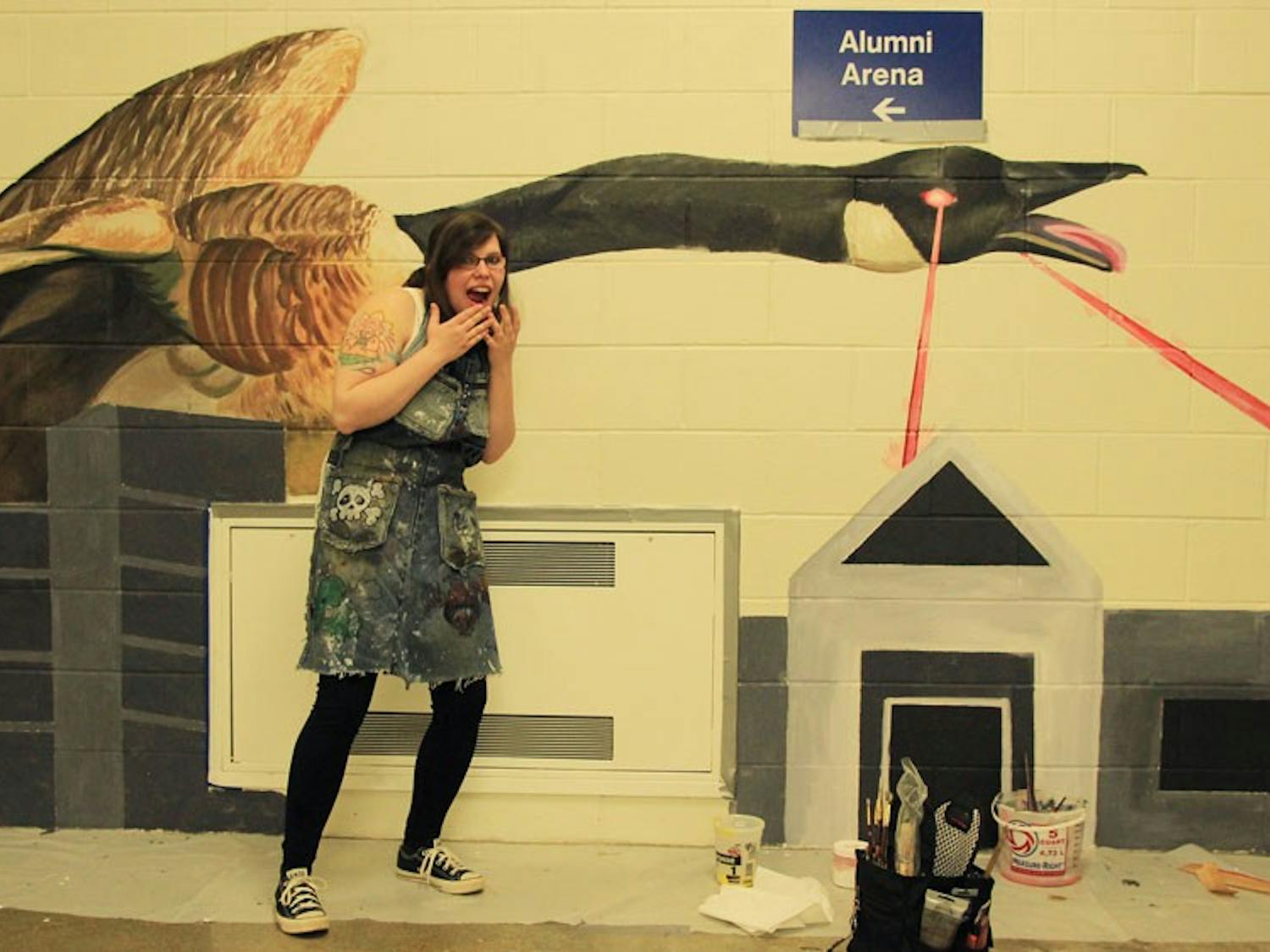 Senior fine arts student Cassara Martin’s giant, super goose shoots burning lasers in her mural, her humorous conceptualization of UB’s annual goose invasion.