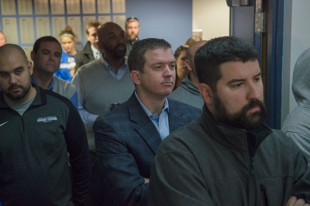 <p>Former UB Athletic Director Danny White (center) listens during Allen Greene's introductory press conference in UB Stadium.&nbsp;White, hired by UCF as its new athletic director two weeks ago, made his first hire in Oregon Offensive Coordinator Scott Frost on Tuesday.</p>