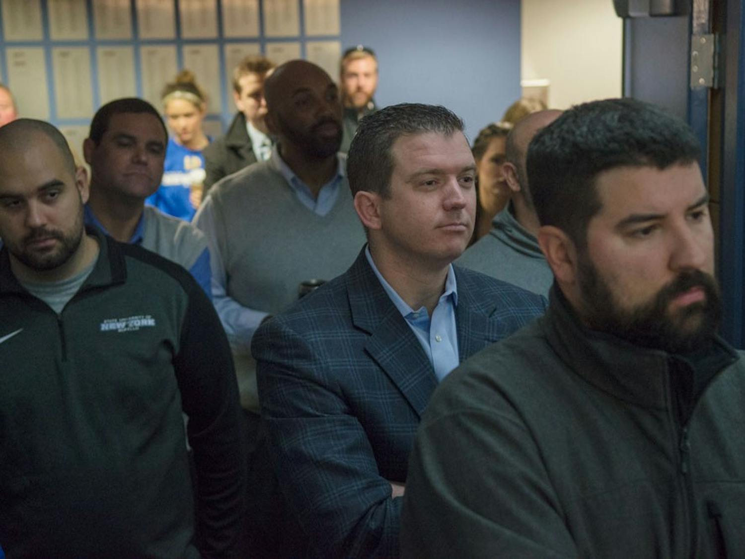 Former UB Athletic Director Danny White (center) listens during Allen Greene's introductory press conference in UB Stadium. White, hired by UCF as its new athletic director two weeks ago, made his first hire in Oregon Offensive Coordinator Scott Frost on Tuesday.