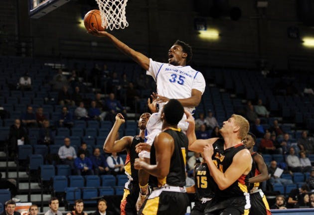 Senior forward Xavier Ford drives through the defense to score a basket. The Bulls kick off their season on Friday when they play San Diego State.&nbsp;Yusong Shi, The Spectrum