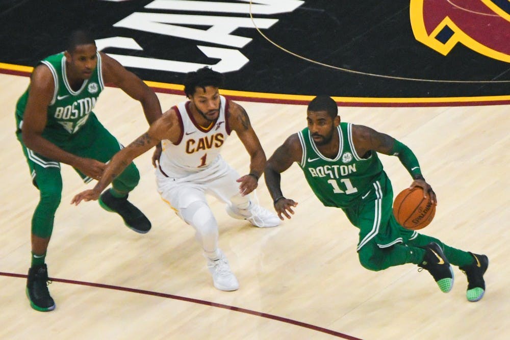 <p>Celtics point guard Kyrie Irving drives past Derrick Rose. The Celtics play the Philadelphia 76ers on Christmas day.</p>