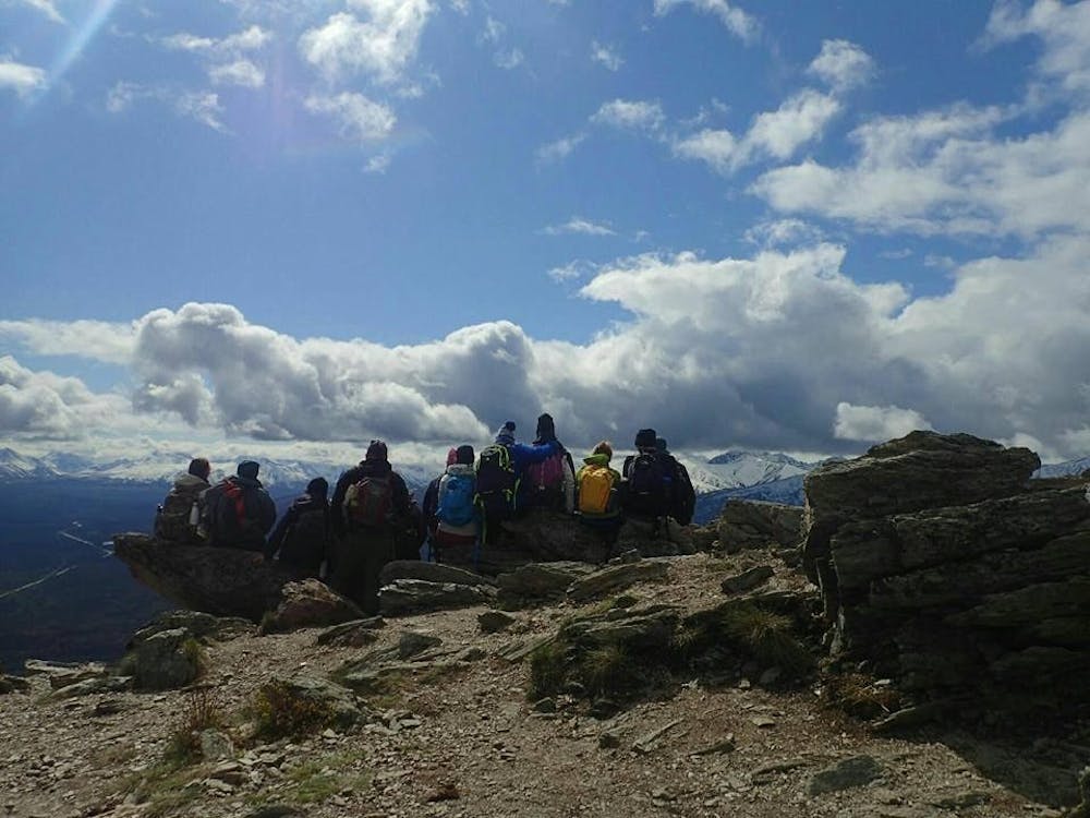 <p>Students sit on the edge of an Alaskan cliff.&nbsp;Week three of Outdoor Nations’ “Campus Challenge” has begun, with UB sitting at rank 15 out of the 90 schools participating.</p>