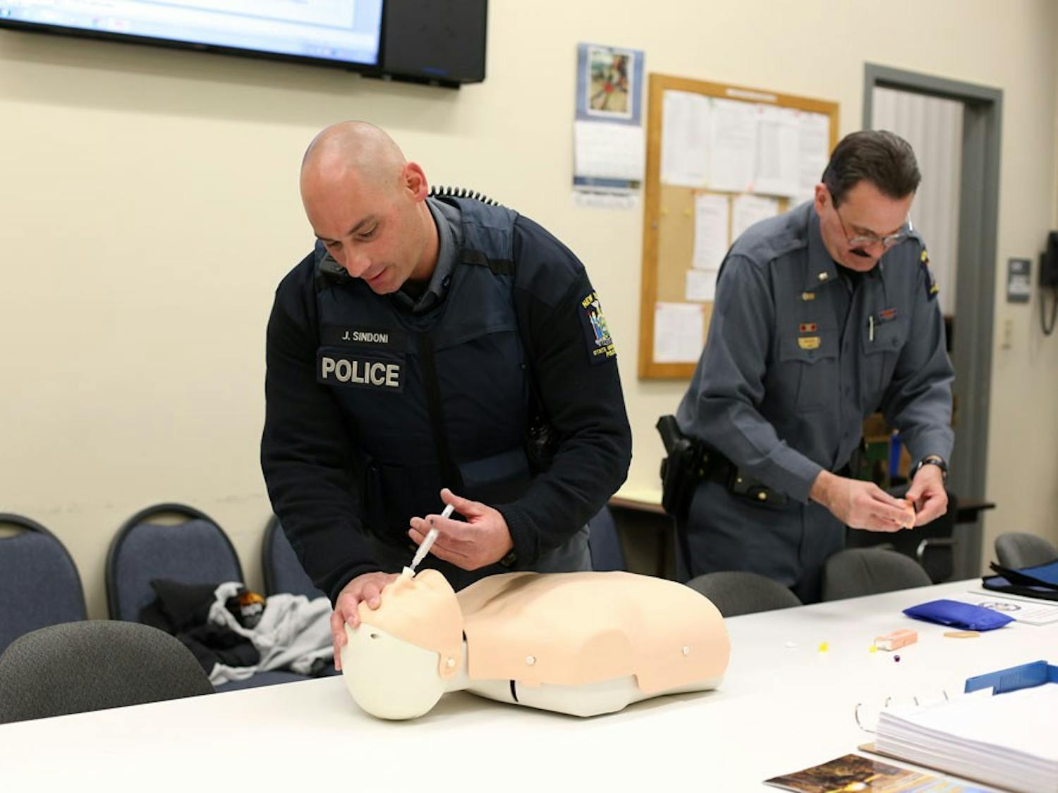 UPD officer John Sindoni administers Narcan on a dummy last April. Sindoni was one of three UPD officers recognized at SUNY Chiefs Association Awards last month.