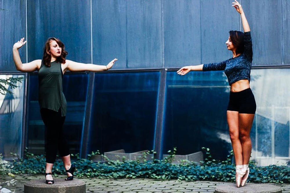 <p>Samantha Pfeiffer (right) and Natalia Sarmiento (left) pose outside Lockwood Library on North Campus. This semester, Deja Stevens started Fusion UB Dance &amp; Photography, a collaborative project where over 40 UB dancers, filmmakers and photographers tried to display UB and Buffalo at its most artistic. The first event was held Sept. 20 and Stevens is already at work planning for next semester.</p>