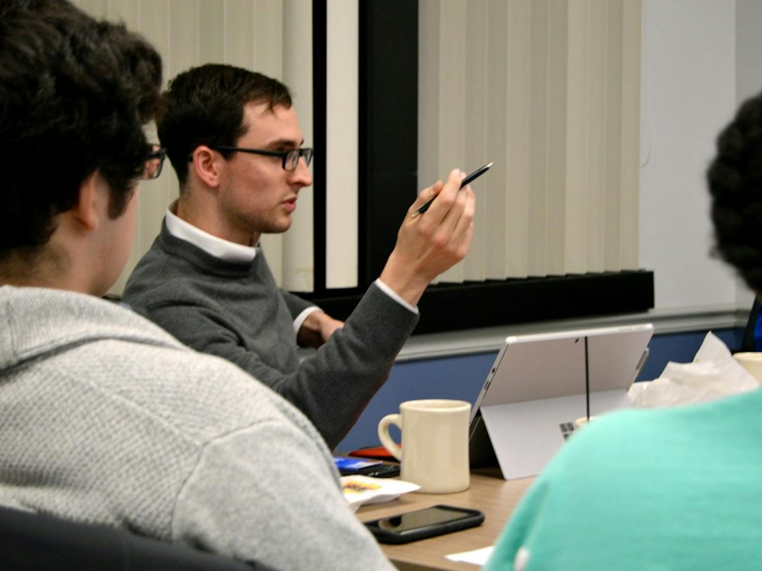 Speaker of the SA Assembly Mike Brown and assembly members discuss a proposed 18 and up bar near South Campus. While some students could see benefits to the proposed bar, the Assembly passed a resolution opposing it six to two, with three members abstaining.