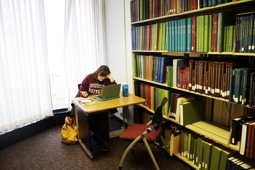 A student studies in the Music Library in December. UB announced a plan to move the library on Thursday.