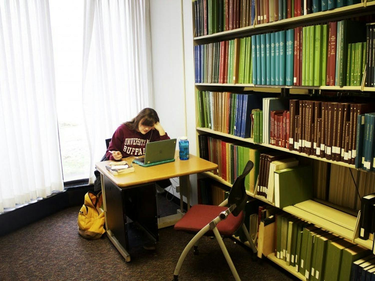 A student studies in the Music Library in December. UB announced a plan to move the library on Thursday.