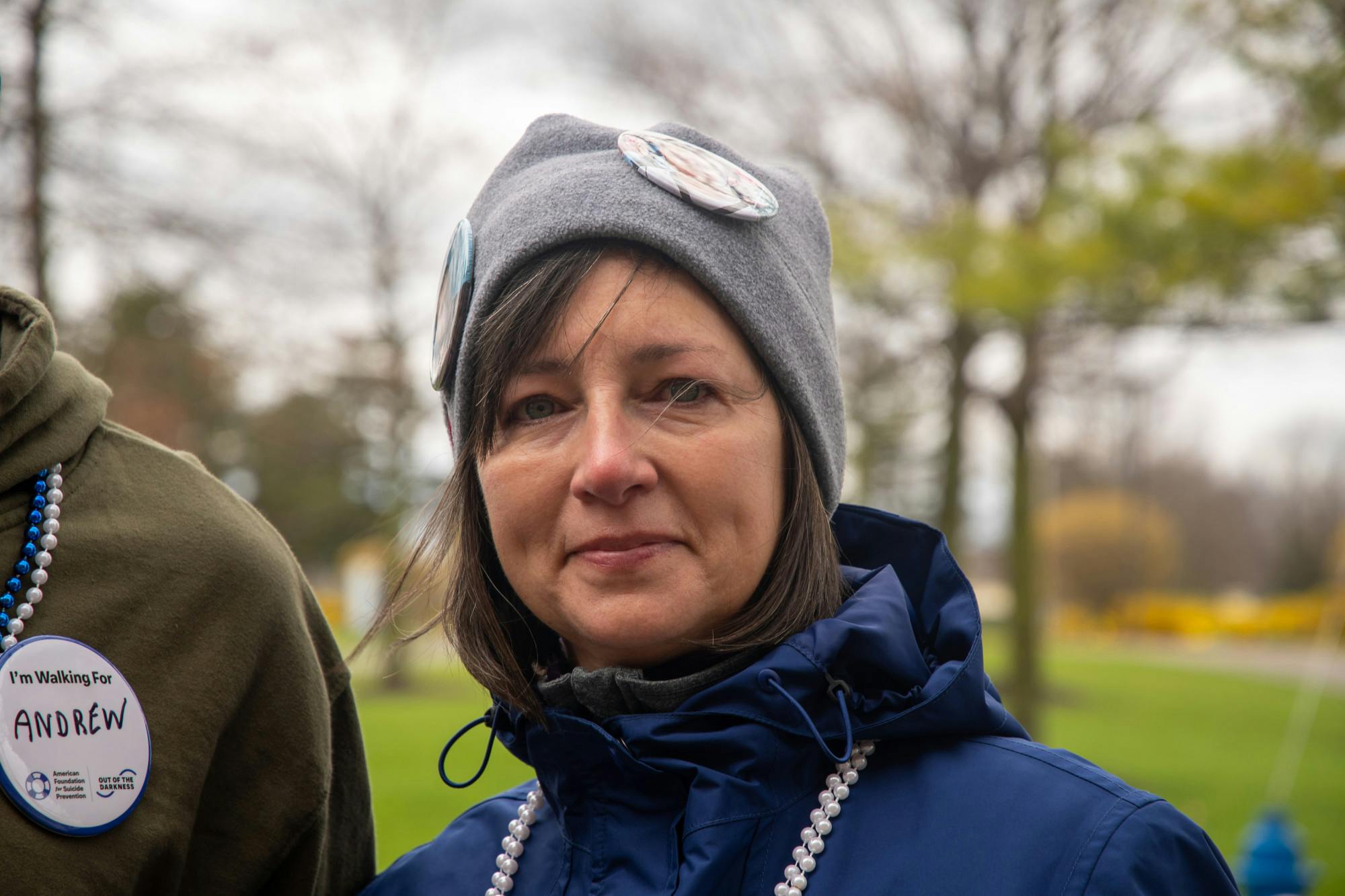 &nbsp;
Deb Kocieniewski – Mother who lost her son, Andrew, to suicide&nbsp;
Q: Why are you here today?&nbsp;
“I am here today because my son, Andrew, died by suicide in December of 2023.”&nbsp;
Q: What does having a walk like this mean for you personally?
“For me, I feel like I’m not alone…. But also, I want to be here to support everyone who might be struggling, or know of someone who might be struggling. It builds a nice sense of community and togetherness and help.”
Q: What can we do on an individual level to talk with people who are struggling with these issues?
“For me, the most important thing to help others is just to continue reaching out just to be kind, to ask people how they’re doing. To reach out in any little way to anyone can make a huge difference to try and get people to open up about how they’re feeling or to just give them hope that someone’s there for them.”
Q: How do we begin to destigmatize issues around mental health?&nbsp;
“I think the best way is to talk about it. To make it a topic of conversation, not hide your experiences or how you feel and make it become more commonplace, so that it’s just part of the normal conversations in everyday lives.”
Q: Is there anything you’d like to share with the UB community today?&nbsp;
“I would ask everyone to continue to stay strong. If you are struggling, don’t be afraid to reach out for any help if you need it. There’s always someone there to listen, and someone to help you. It could be someone you’d least expect, but there’s always love from others. Just continue to fight and continue to fight for those that are in your life.”
Q: Is there anything you’d like people to know about your son?&nbsp;
“My son, Andrew, was amazing. He was a teacher’s aide at Randolph Academy dealing with behavioral problem children. He gave his life and love to everyone. And he was a great brother. He did struggle with mental health, and he knew it and did seek help along the way. And we just miss him dearly.”