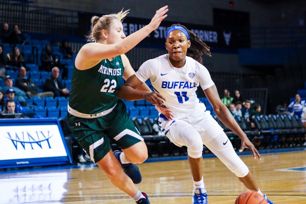 <p>Senior guard Theresa Onwuka beats a defender to the basket.</p>