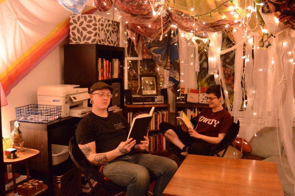 Residents of the Q3C Co-op sit in their community library. Co-ops offer an alternative housing option for many young people.