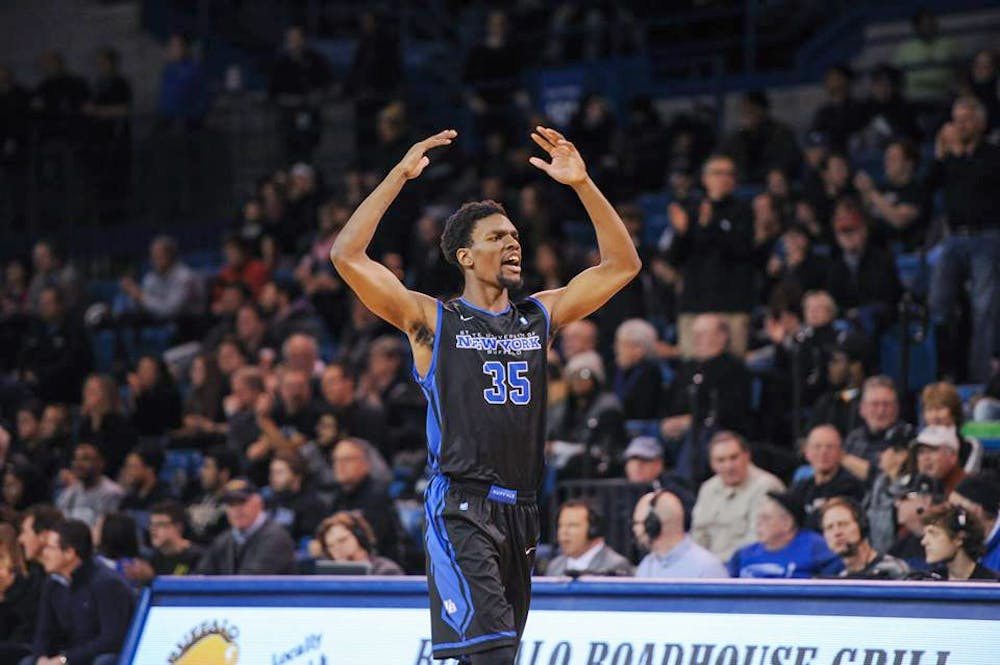 <p>Xavier Ford celebrates during Buffalo's victory over Kent State in Alumni Arena last season. Ford signed a D-League contract and hopes to make an impact on his hometown and eventually get to the NBA. </p>