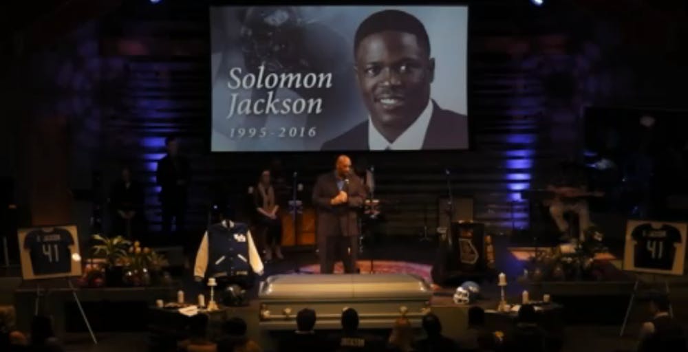 <p>UB defensive line coach Tim Edwards speaks during a viewing and service for Solomon Jackson at The Well Buffalo Church Thursday.&nbsp;</p>