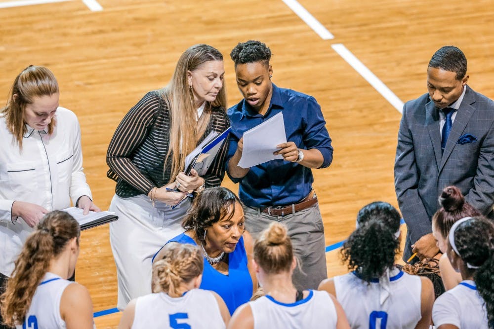Director of Operations for the women’s basketball team Karin Moss works with the team on the sideline. Moss was a member of the 2015-16 MAC Championship season and has now returned to the team for a new staff role.