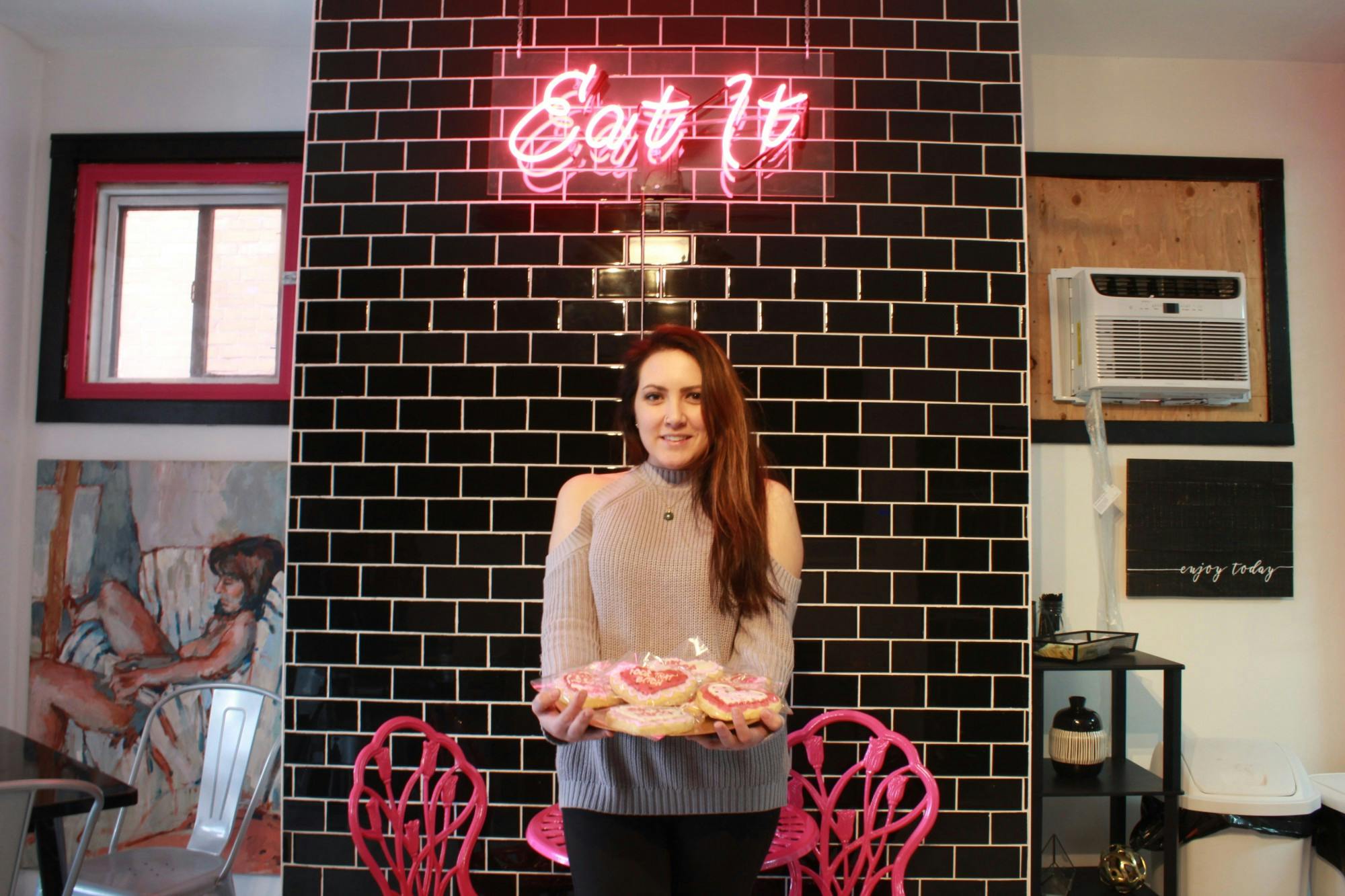 Mundy Cakes owner Amanda Bernardini poses with cookies inside Mundy Cakes on Allen Street.