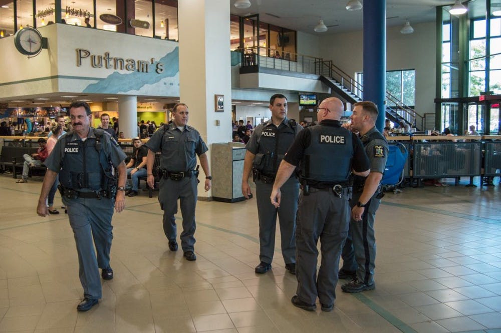 <p>Several University Police patrol the Student Union Monday afternoon after a report of a gun being dropped in the Union. </p>