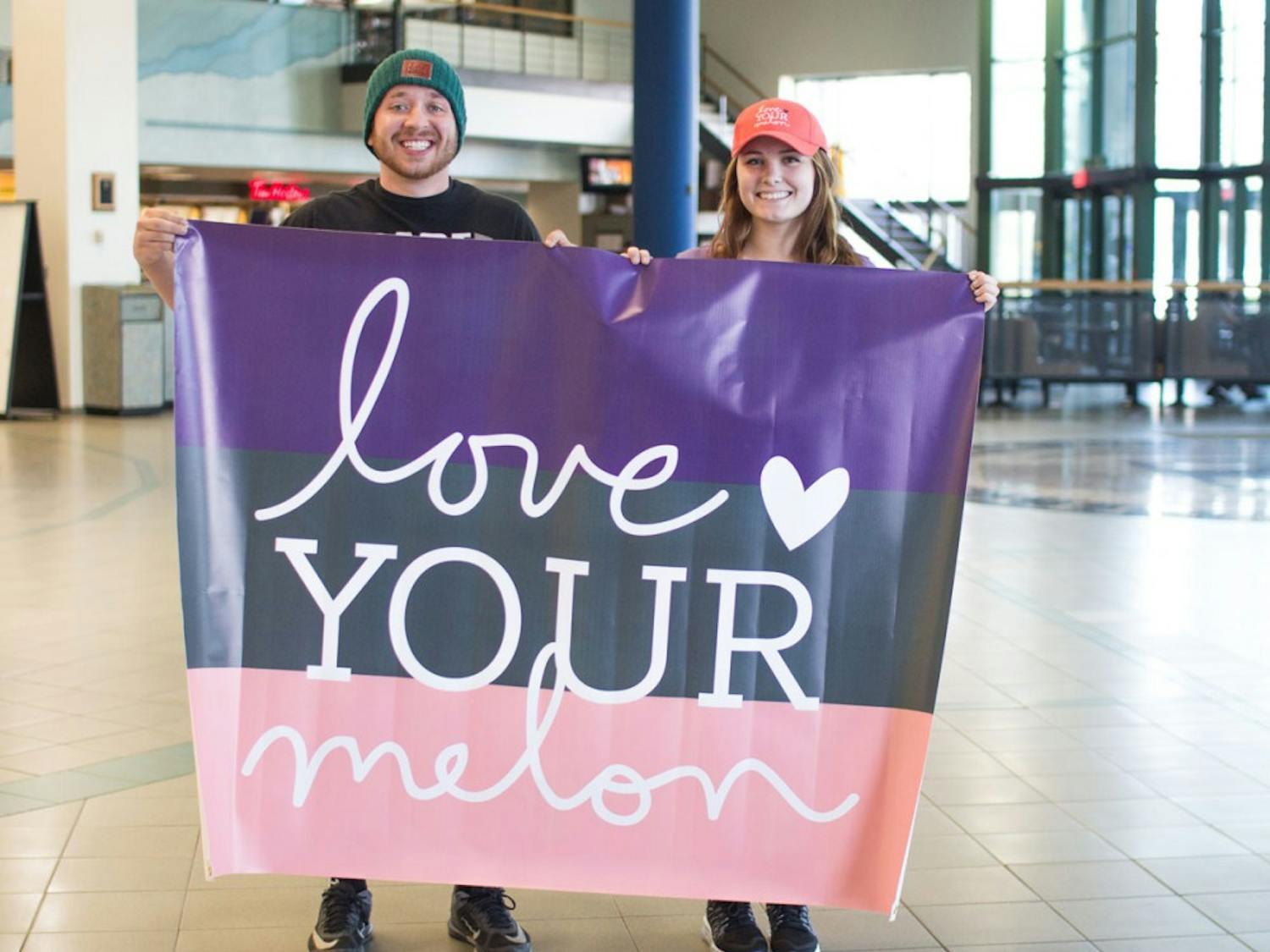 Kim Charleson (right) and Matt Kondziela (left) are two UB students and members of UB Love Your Melon. Love Your Melon is a nonprofit organization that donates beanies to children cancer patients across the country.