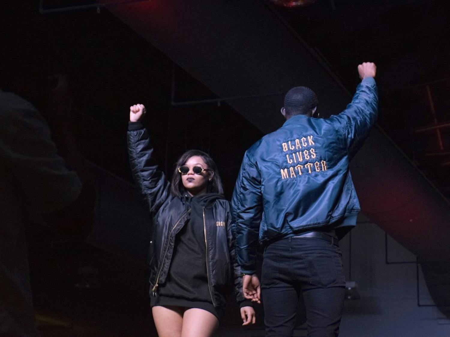 Models pose on the runway during BSU's annual Black Explosion fashion show. The models are wearing Raishawn Washington's designs from his Fruition collection. 