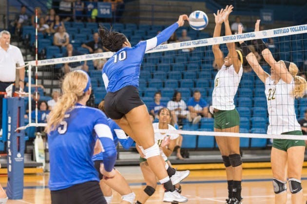 Junior middle blocker Akeila Lain sets up a spike. The volleyball team was perfect in its three games this weekend, going 3-0 to win the UIC Tournament Championship.