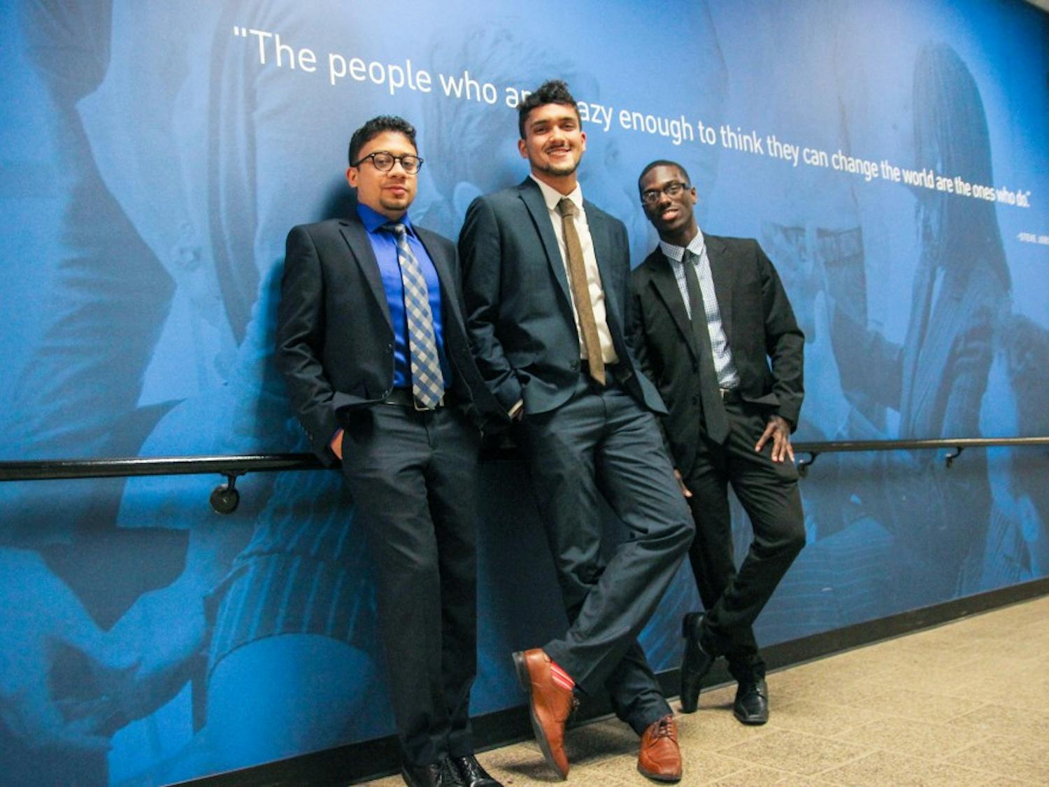 (left to right) Abid Alam, Hnu Thaper and Elijah Tyson pose in front of the Blackstone Launchpad office in the Student Union. The trio founded Coldspace to create a solution to food storage on campus.
