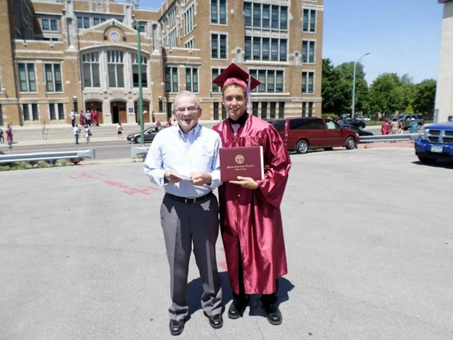 Former Stampede supervisor Victor Zoizack and his grandson, Justin at his high school graduation from Hutch Tech High School. Zoizack died of a heart attack on Nov. 19, 2014 at the age of 74. He will be remembered by his coworkers for being a hard worker and always bringing in a box of doughnuts. Courtesy of Justin Zoizack