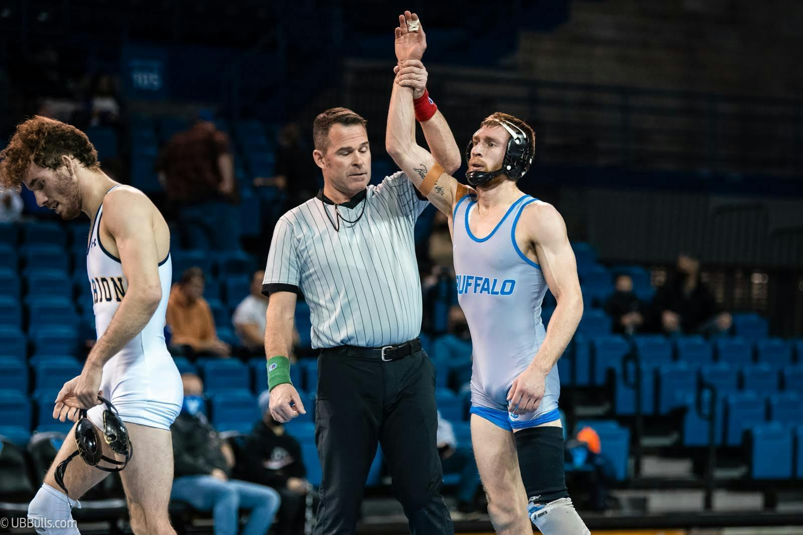 Graduate student Derek Spann is declared the victor after a recent match.&nbsp;