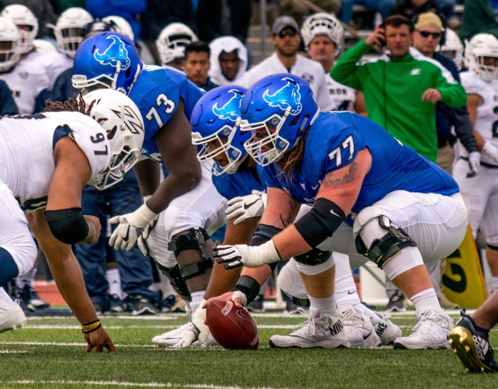 James O’Hagan prepares to snap the ball. The center has been named a midseason All-American by USA Today and Pro Football Focus.