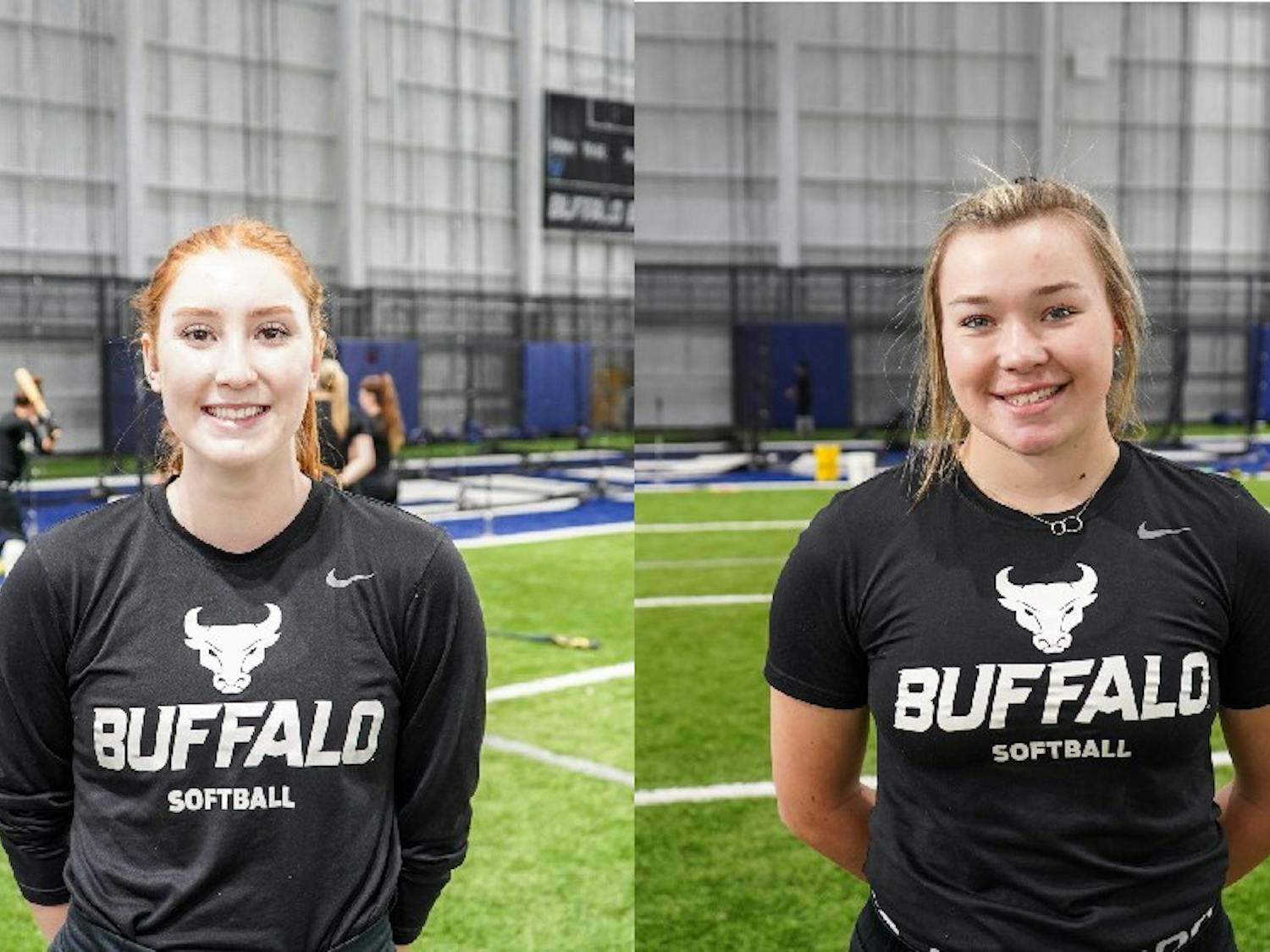 Freshmen pitchers Alexis Lucyshyn and Madelyn Hickingbottom discuss their experiences being on the UB women's softball team during practice at the UB fieldhouse on Tuesday.
