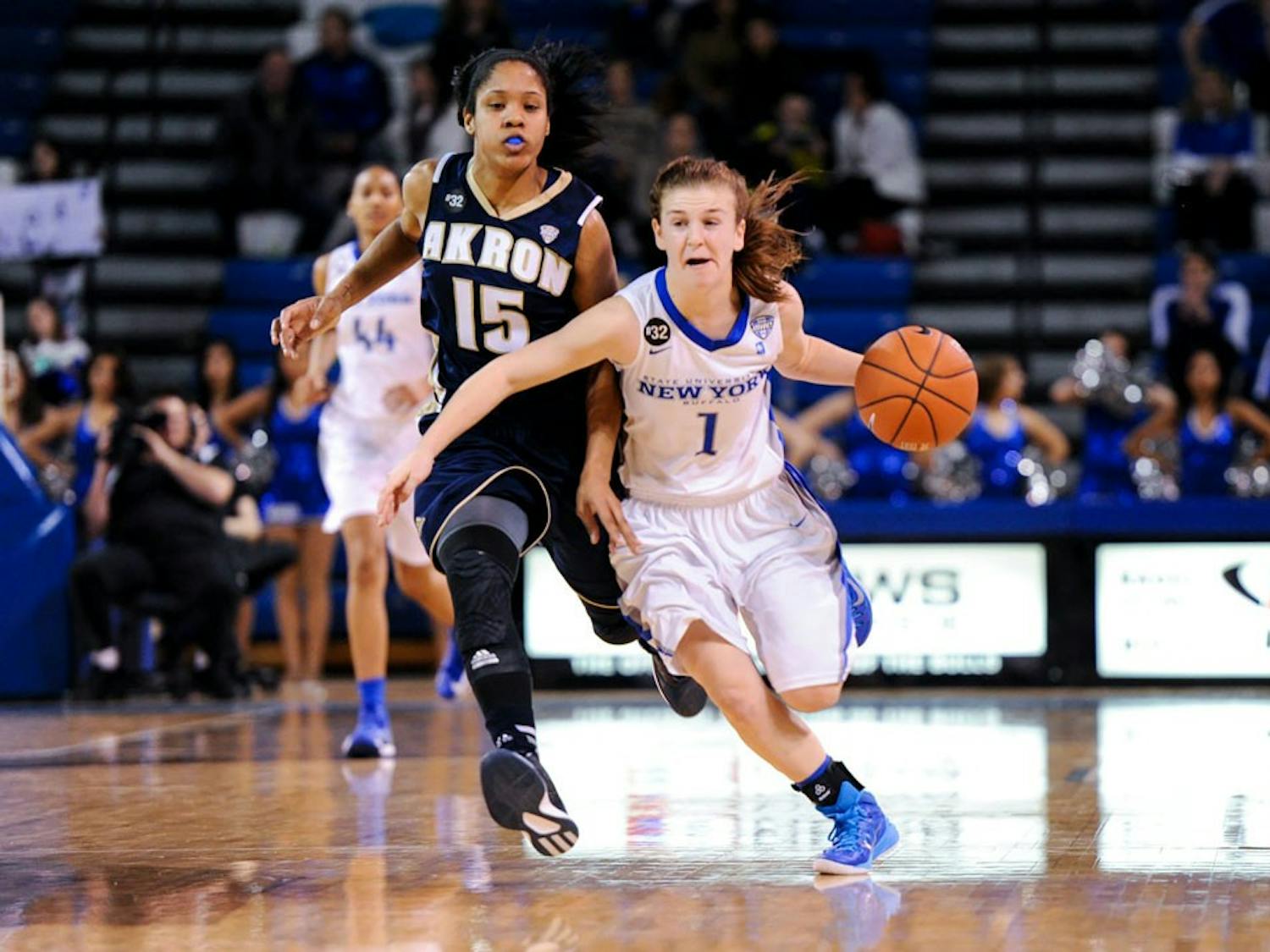 UB's Stephanie Reid drives to the basket against an Akron defender. Reid finished with 21 points and four assists in the Bulls’ 16th win of the season.