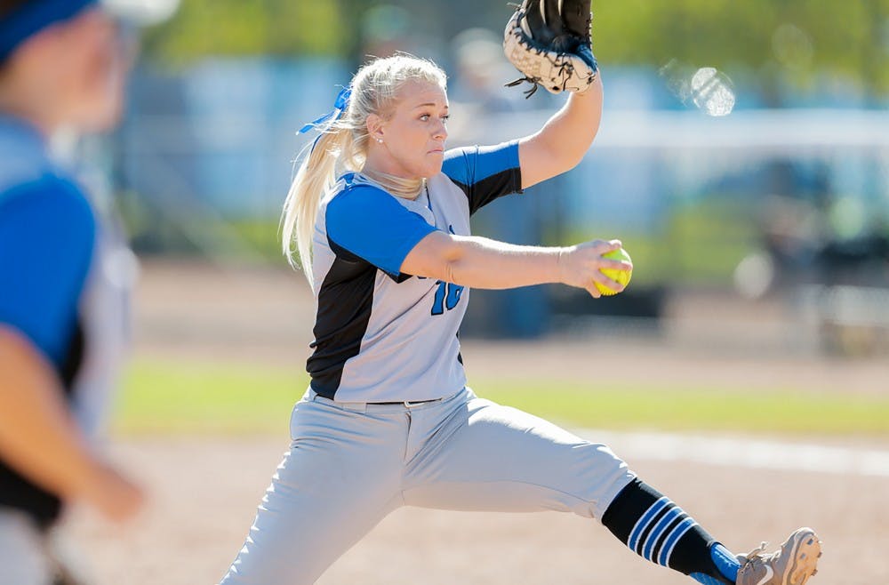 <p>Junior pitcher Ally Power winds up for the pitch. Power and the Bulls are getting ready for a three game series against the Northern Illinois Huskies.</p>