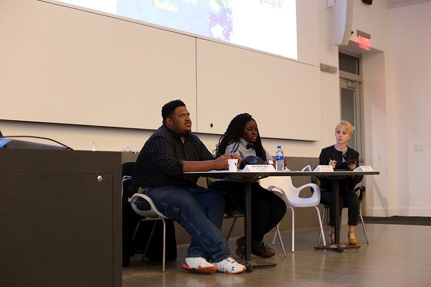 Panelists John Washington (left) and Jessica Coley (middle) discuss concerns on how the university’s three campuses are impacting Buffalo neighborhood.&nbsp;The panelists’ speeches were followed by a Q&A, where the crowd asked questions about the way the university’s campuses are impacting the surrounding neighborhoods.
