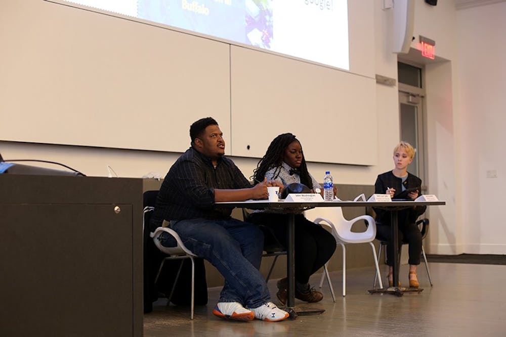 <p>Panelists John Washington (left) and Jessica Coley (middle) discuss concerns on how the university’s three campuses are impacting Buffalo neighborhood.&nbsp;The panelists’ speeches were followed by a Q&A, where the crowd asked questions about the way the university’s campuses are impacting the surrounding neighborhoods.</p>