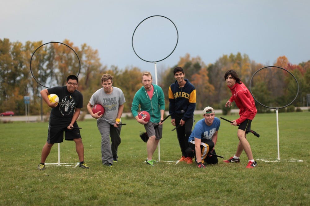 <p>Some members of the UB Quidditch Association practice near Govenors on Thursday. The team, and the sport itself, is looking to move away from its Harry Potter notion and simply be known for its sport.  </p>