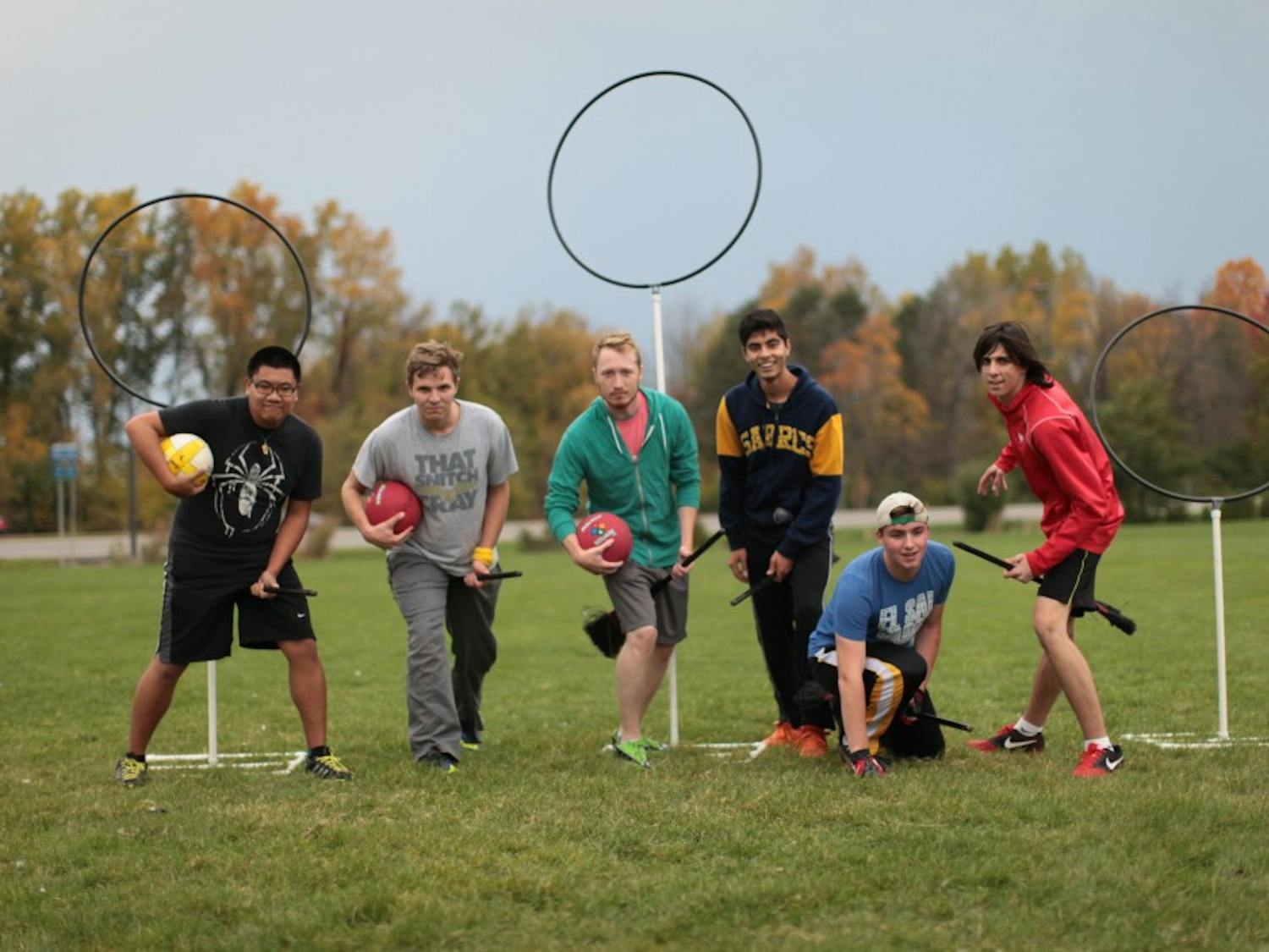 Some members of the UB Quidditch Association practice near Govenors on Thursday. The team, and the sport itself, is looking to move away from its Harry Potter notion and simply be known for its sport.  