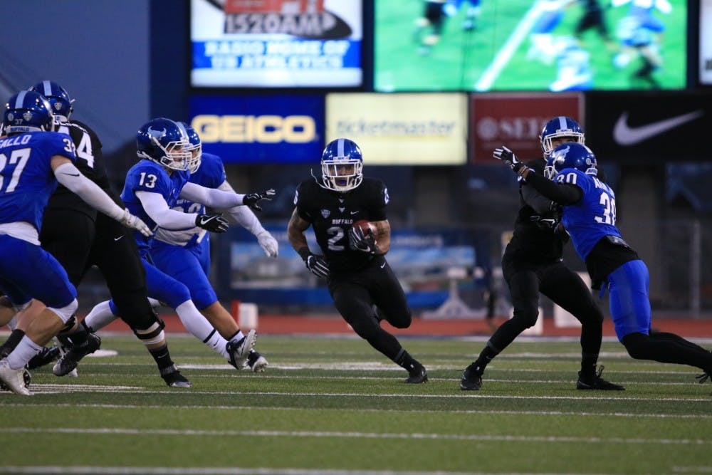Freshman running back Jaret Patterson finds the hole during the annual Blue & White Scrimmage.