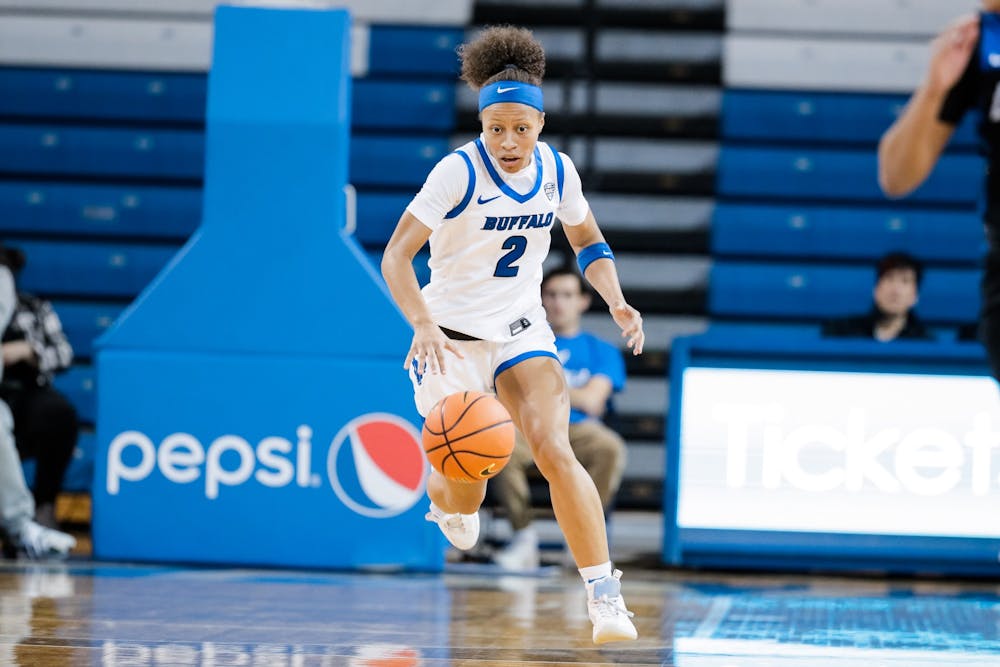 Fifth-year guard and Glenville State transfer Zakiyah Winfield dribbles the ball in a recent game.
