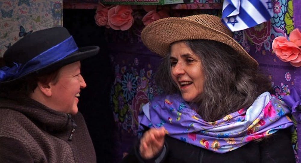 Anna Adam (left) and Jalda Rebling (right) work together on projects like The Happy Hippie Jew Bus,
where they&rsquo;re seated, to teach Germans about Jewish culture in an unconventional way.
Courtesy of Jalda Rebling and Anna Adam&nbsp;