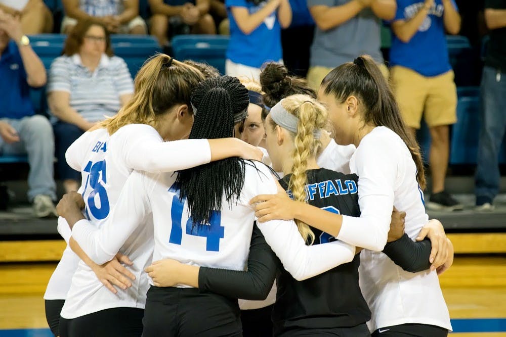 <p>The volleyball team huddling together during a game. The team is coming off a strong weekend and are looking to capitalize on the performance.</p>