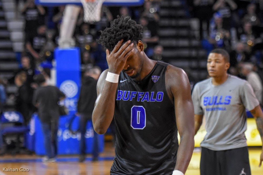 <p>Senior forward Blake Hamilton walks off the court. UB men's basketball fell to Akron 89-83.</p>