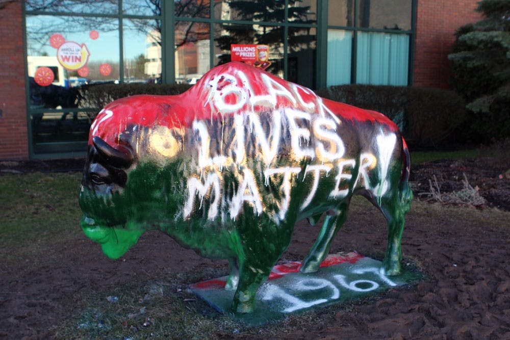 <p>Members of the Black Student Union painted "Black Lives Matter" on&nbsp;the bull outside of the Student Union on March 3, 2017.</p>
