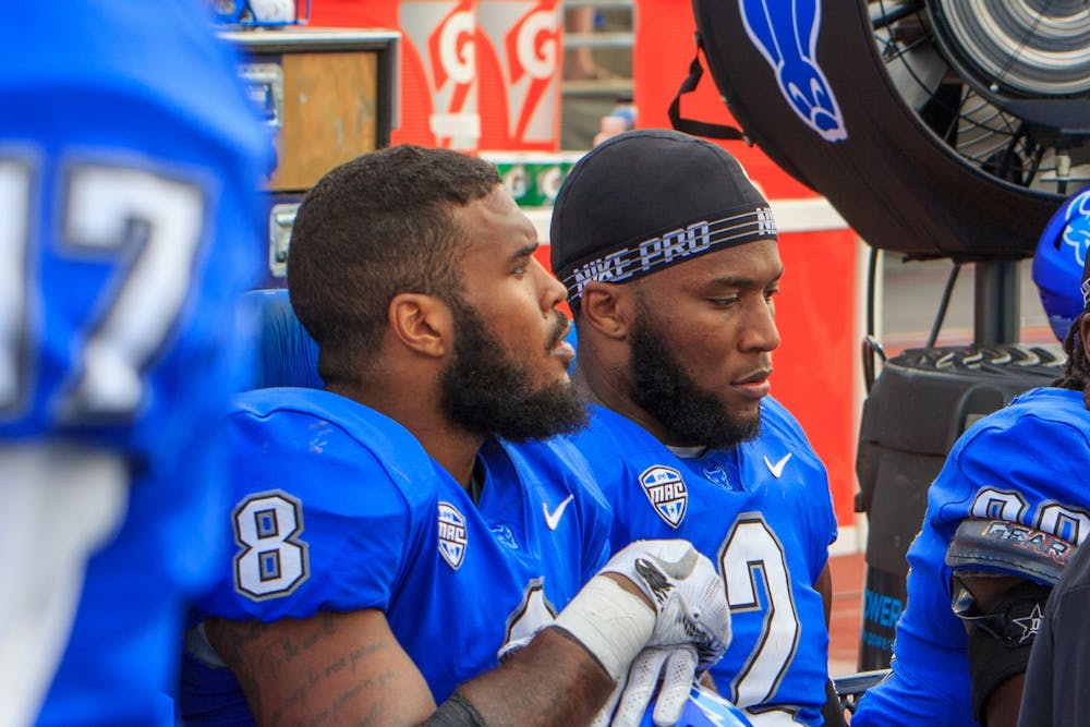 UB linebackers Kadofi Wright (2) and James Patterson (8) sit on the sidelines during a recent game. The Bulls lost to Kent State, 43-38, on Saturday.